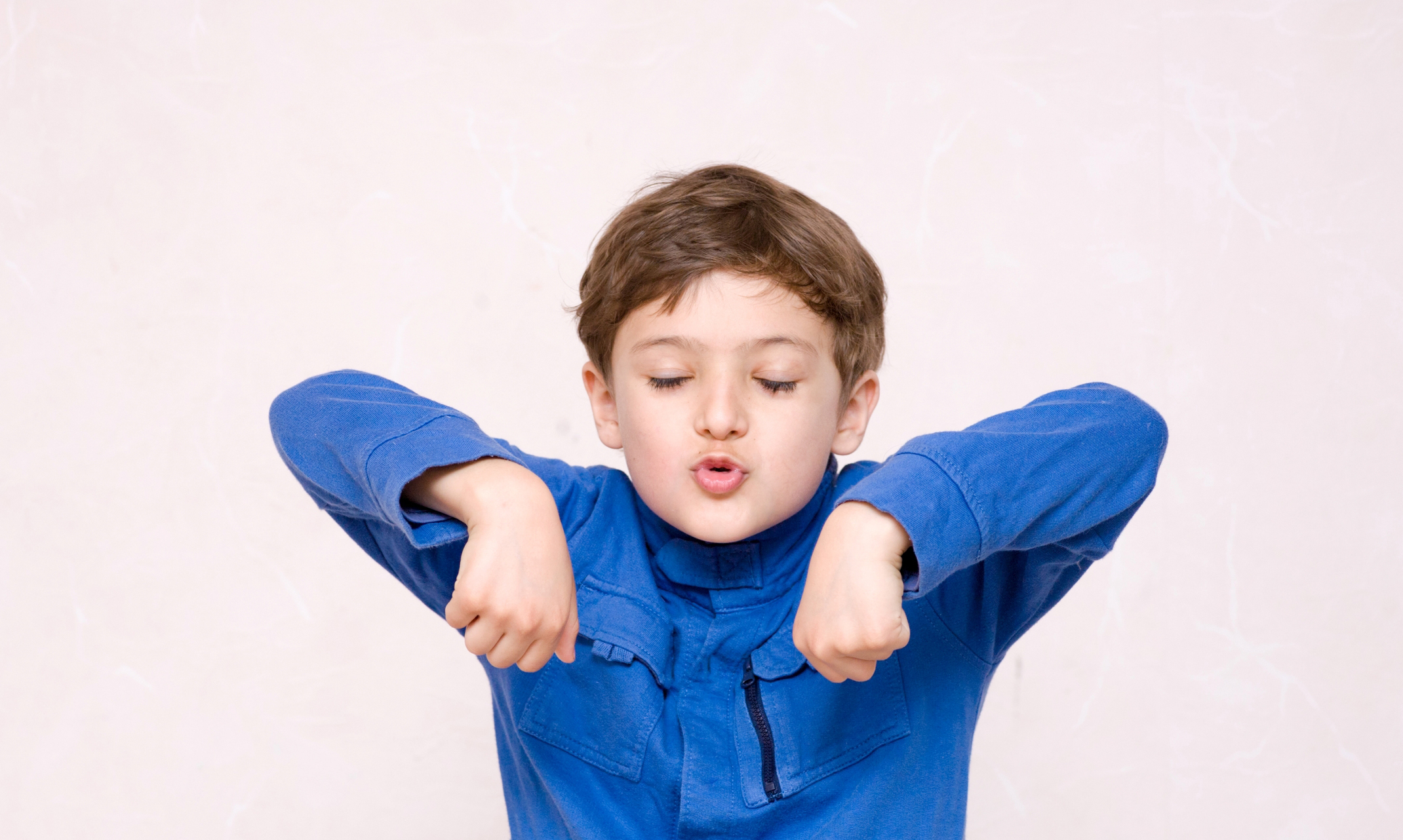 A little boy exhibiting stimming behaviors